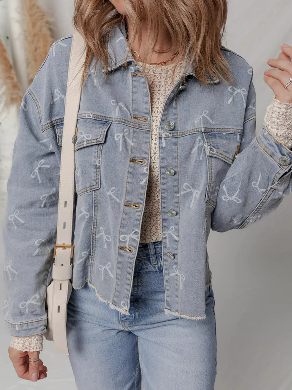 Bow Knot Print Light Wash Raw Hem Denim Jacket by Partner Label