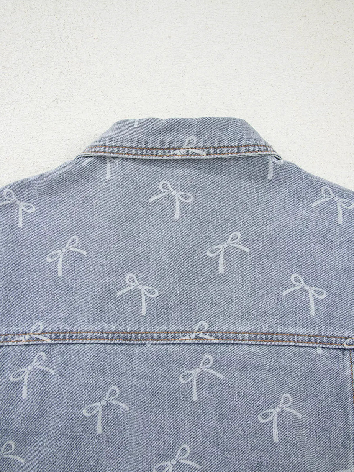 Bow Knot Print Light Wash Raw Hem Denim Jacket by Partner Label