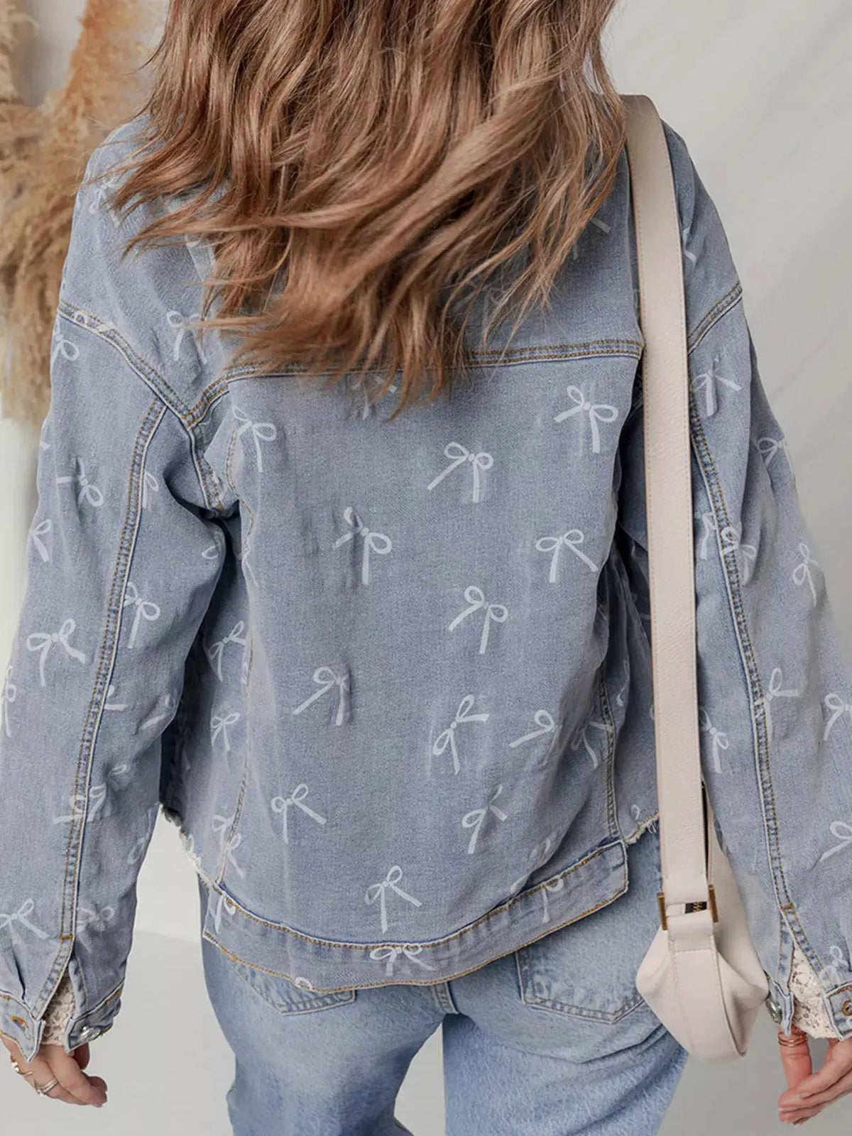 Bow Knot Print Light Wash Raw Hem Denim Jacket by Partner Label