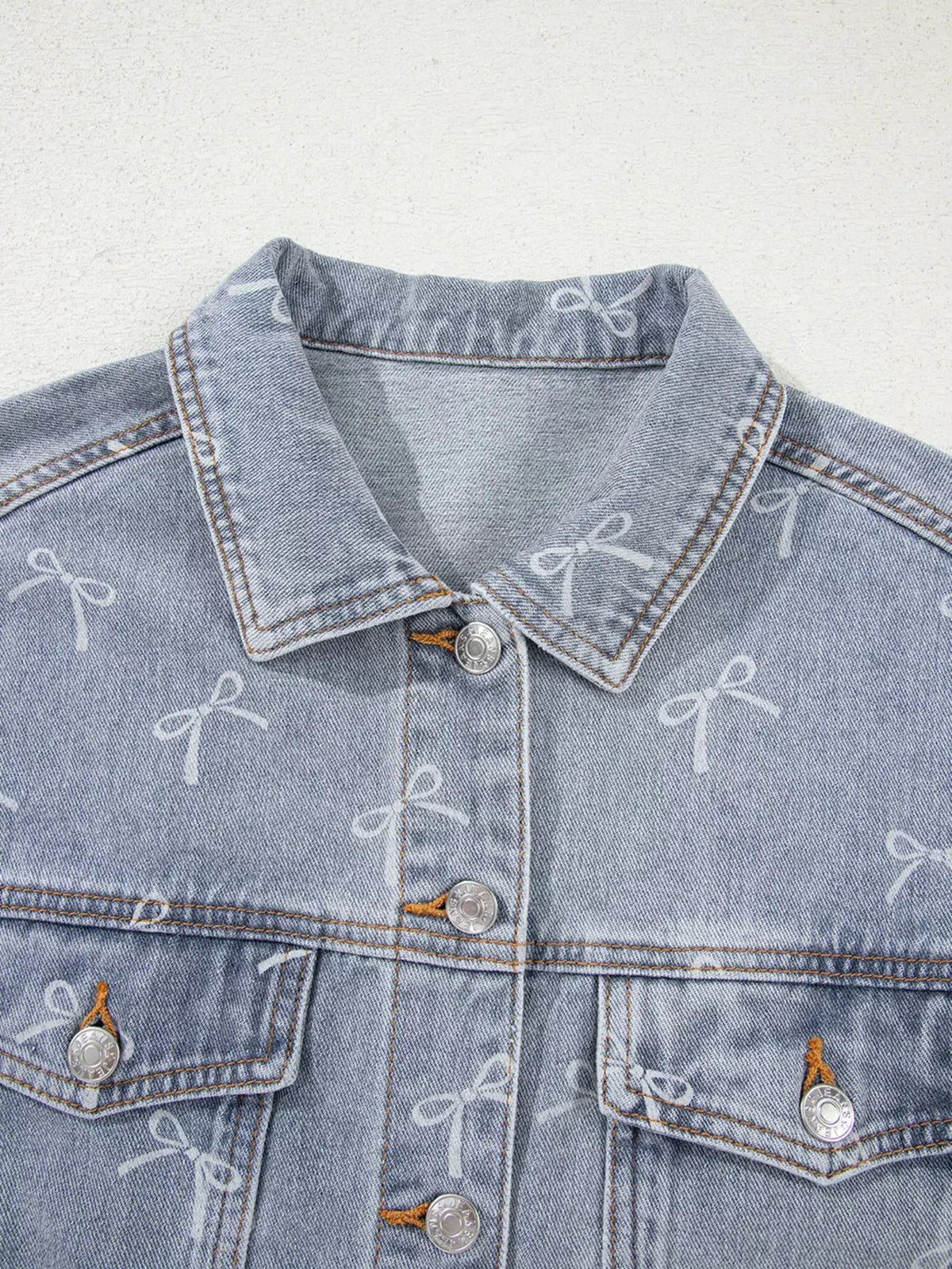 Bow Knot Print Light Wash Raw Hem Denim Jacket by Partner Label