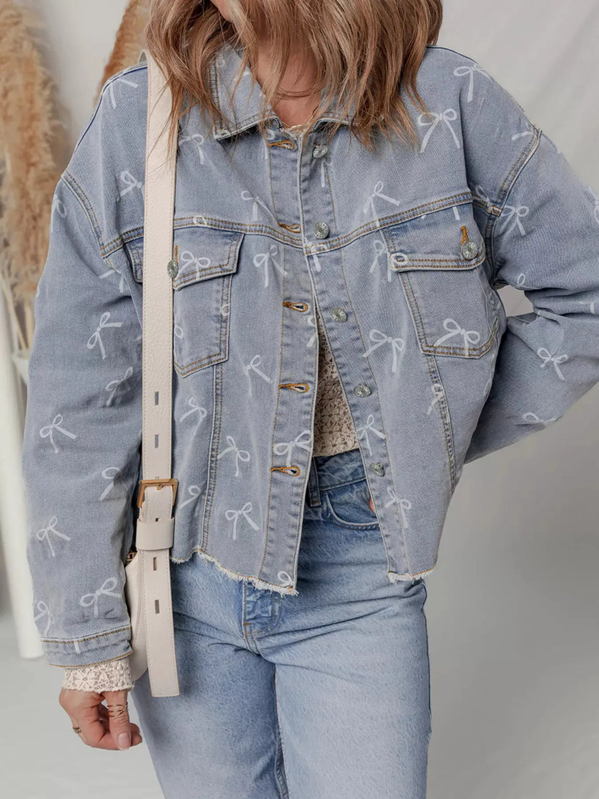 Bow Knot Print Light Wash Raw Hem Denim Jacket by Partner Label